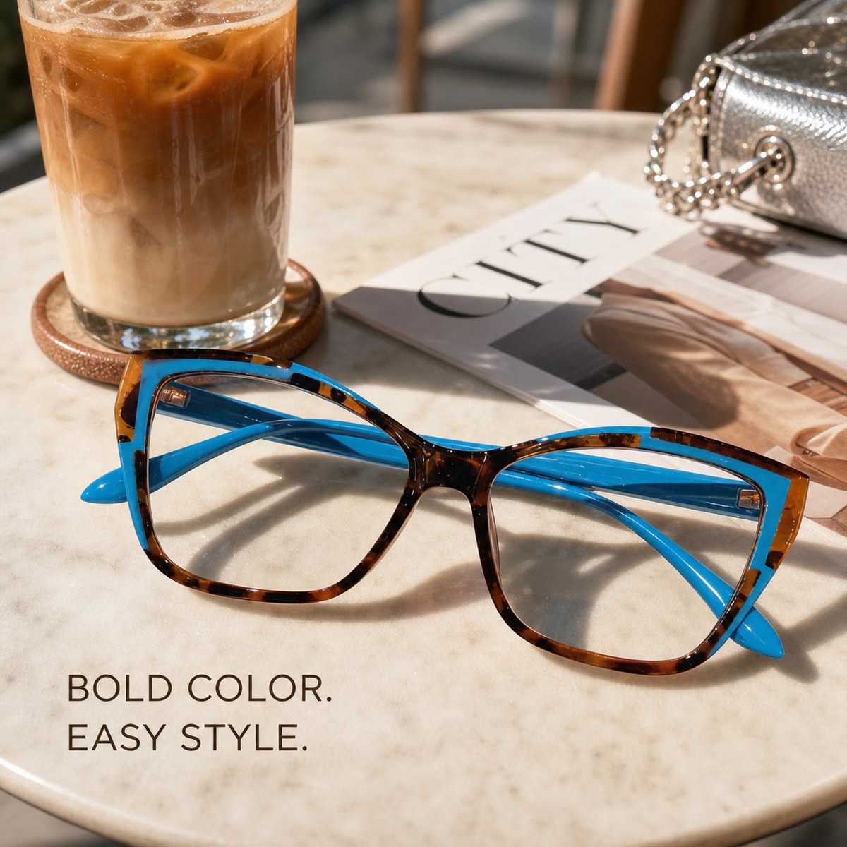 Blue and tortoiseshell fashion frames on a café table